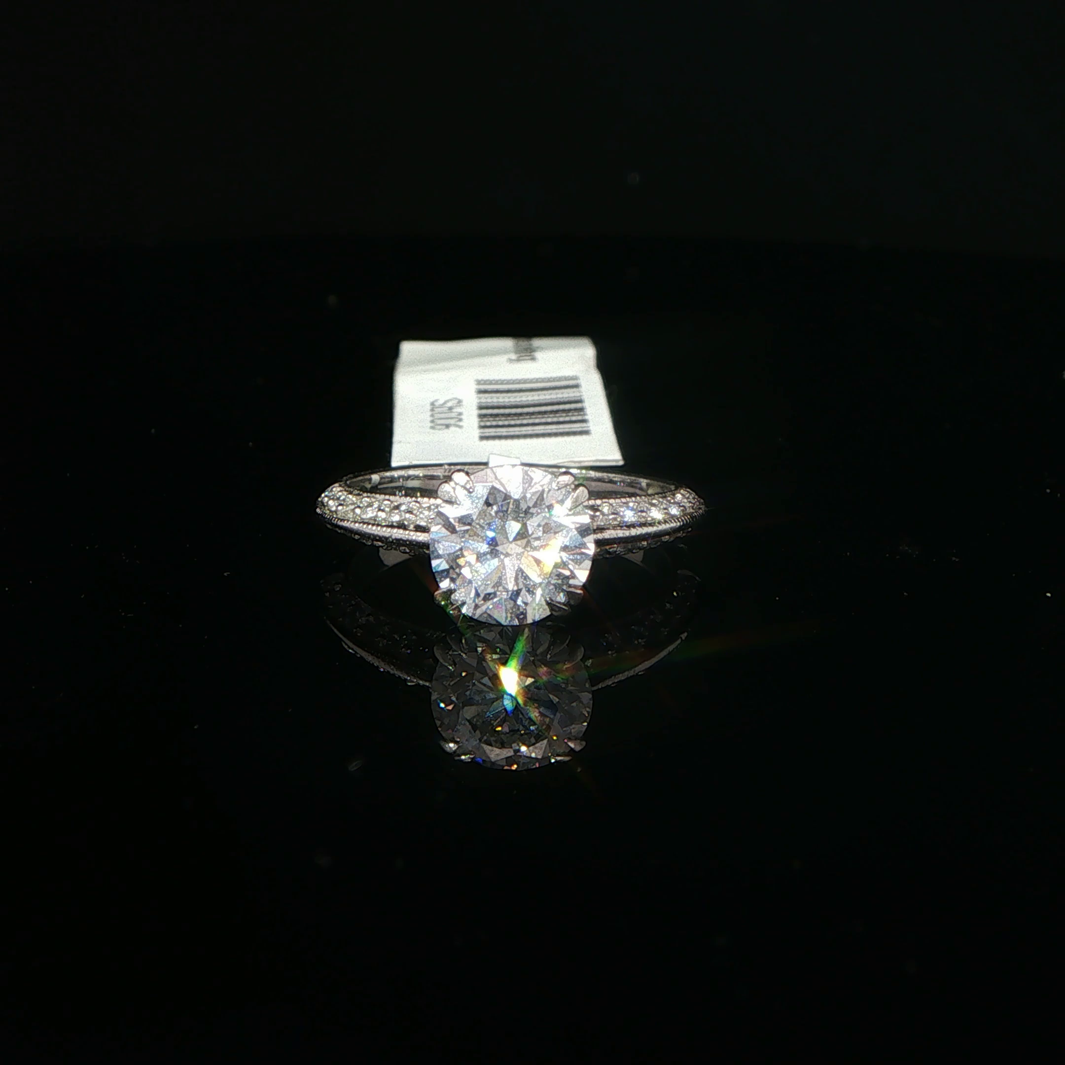 Round Diamond Solitaire Ring with Accented Platinum Band