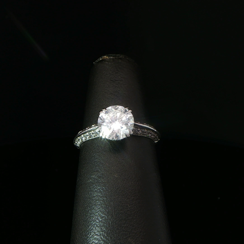 Round Diamond Solitaire Ring with Accented Platinum Band