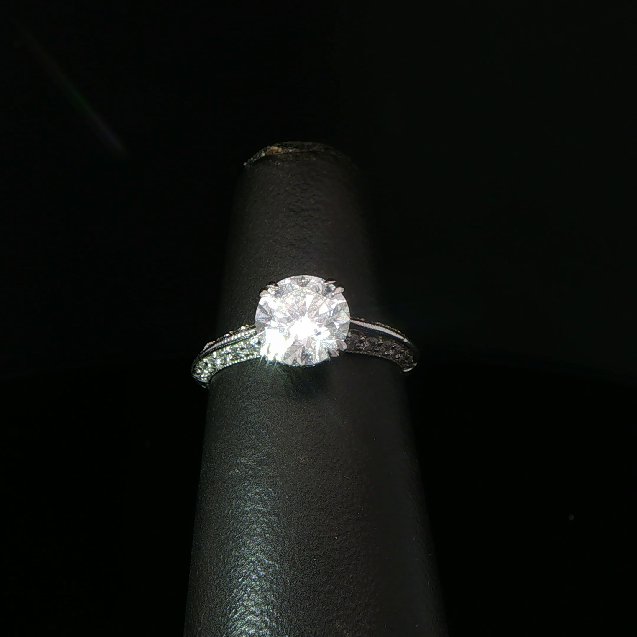 Round Diamond Solitaire Ring with Accented Platinum Band