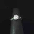 Round Diamond Solitaire Ring with Accented Platinum Band